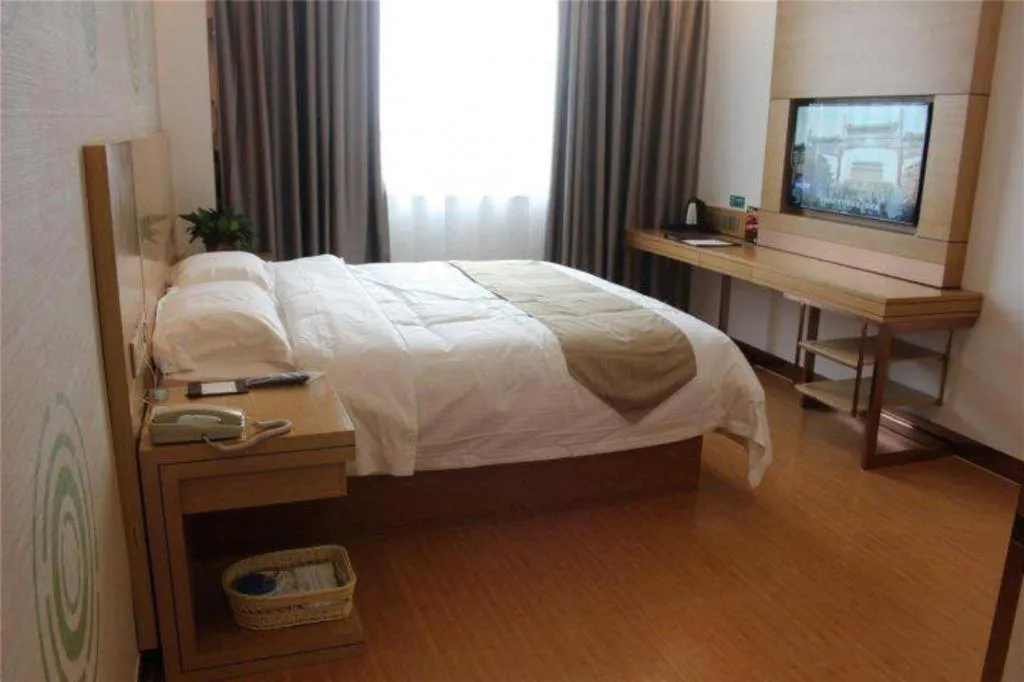 Bed in GreenTree Inn Shandong Heze Caoxian Zhuangzhai Town Oriental Times City Business Hotel