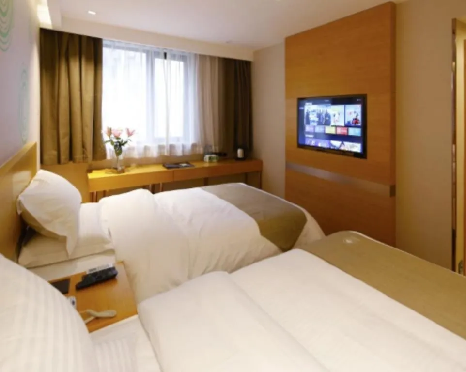 Bed in GreenTree Inn Shandong Heze Caoxian Zhuangzhai Town Oriental Times City Business Hotel