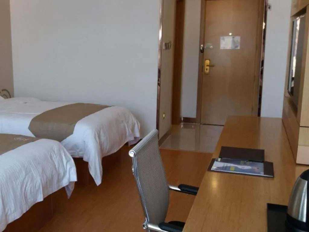 Bed in GreenTree Inn Shandong Heze Caoxian Zhuangzhai Town Oriental Times City Business Hotel