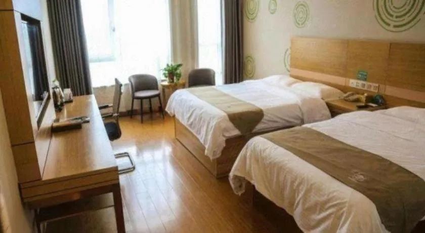 Bed in GreenTree Inn Shandong Heze Caoxian Zhuangzhai Town Oriental Times City Business Hotel