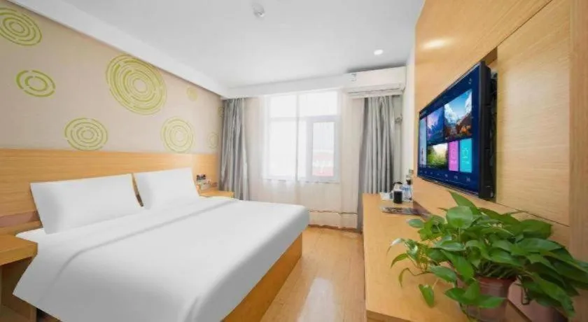Bed in GreenTree Inn Binzhou Wudi County Yinzuo Plaza Express Hotel