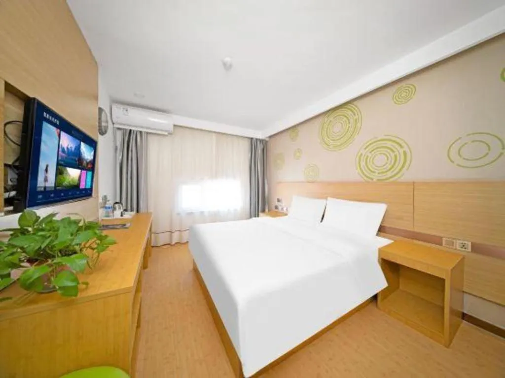 Bed in GreenTree Inn Binzhou Wudi County Yinzuo Plaza Express Hotel