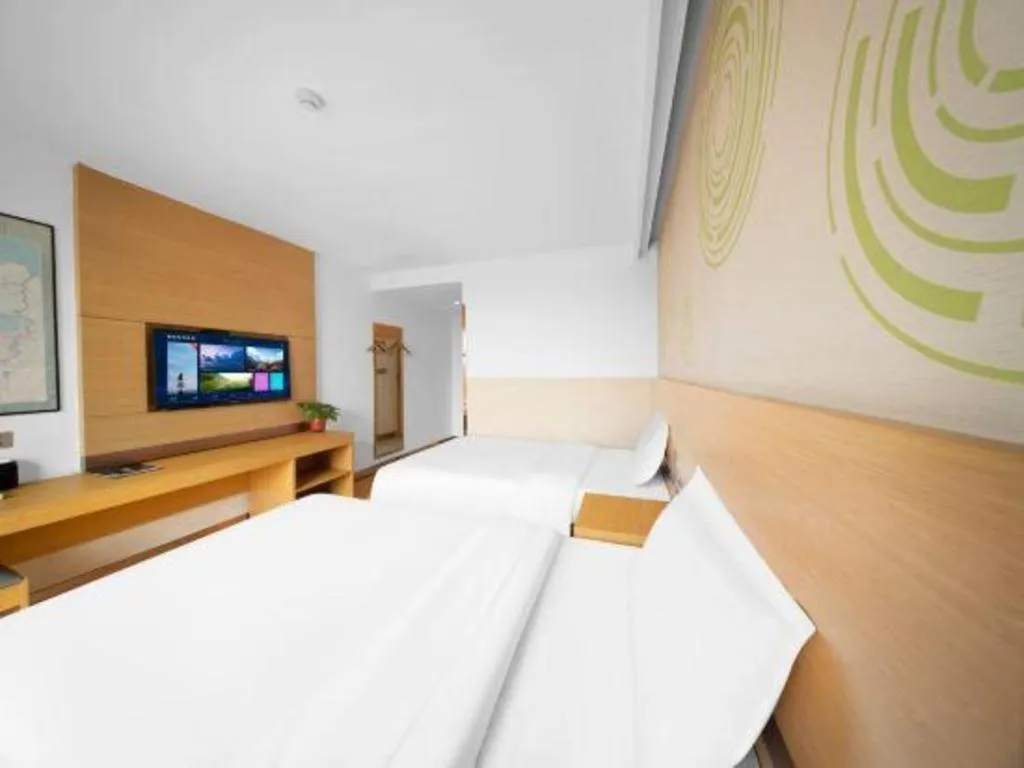 Bed in GreenTree Inn Binzhou Wudi County Yinzuo Plaza Express Hotel