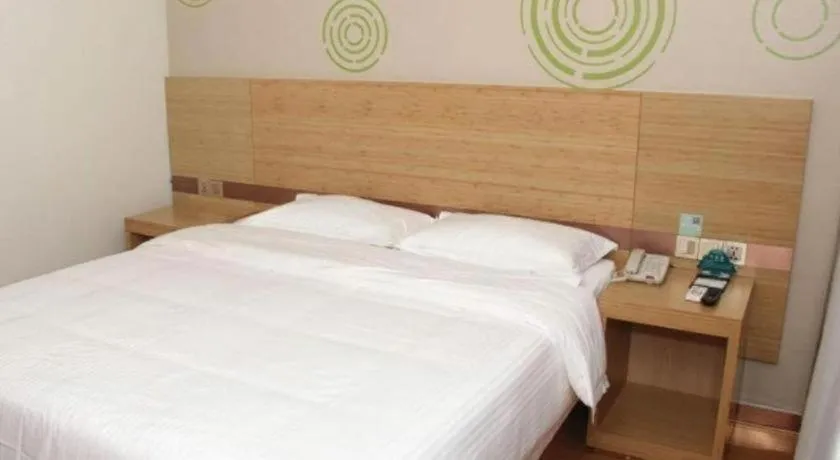 Bed in GreenTree Inn Binzhou Wudi County Yinzuo Plaza Express Hotel