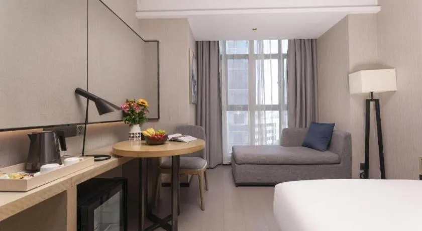 Bed in Echarm Hotel Wuxi Zhongnan Road Ancient Canal