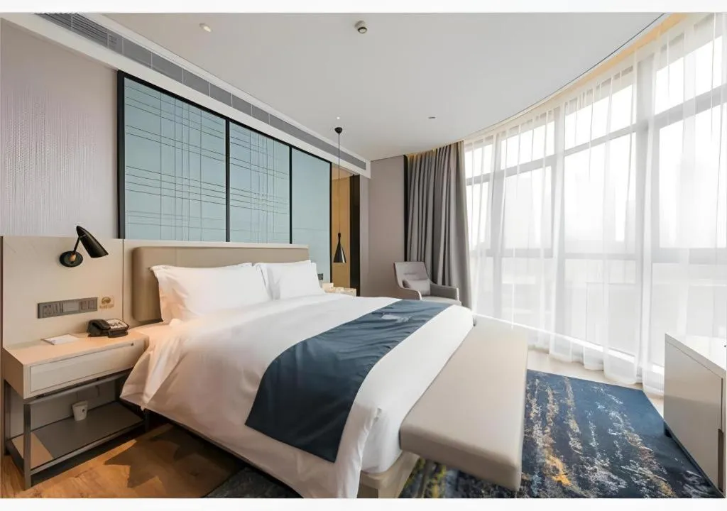 Bed in Echarm Hotel Wuxi Zhongnan Road Ancient Canal