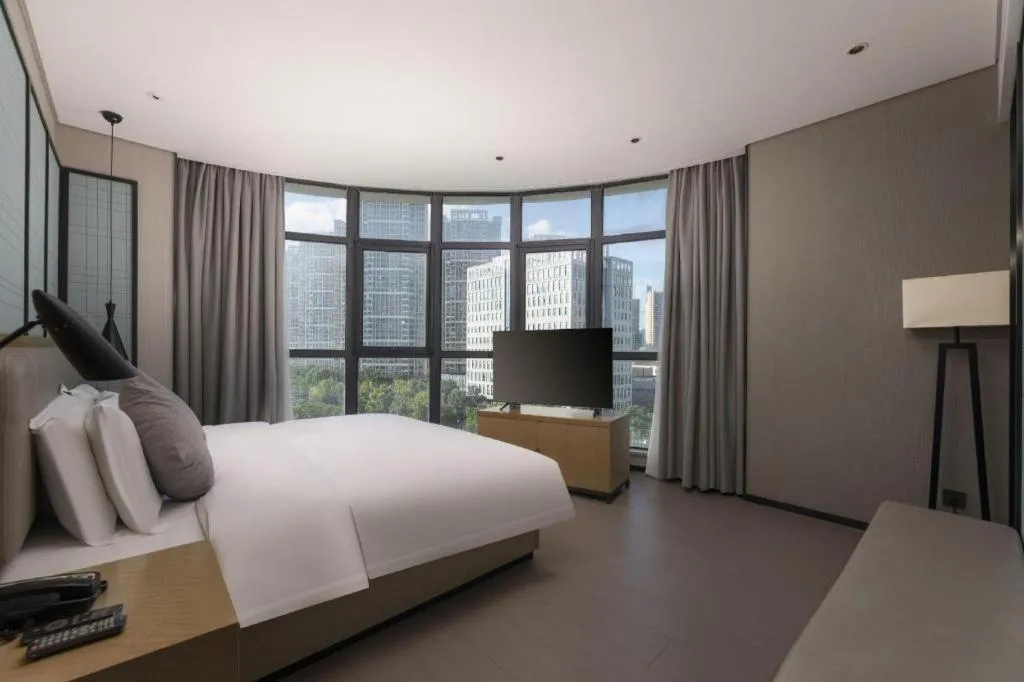 Bed in Echarm Hotel Wuxi Zhongnan Road Ancient Canal