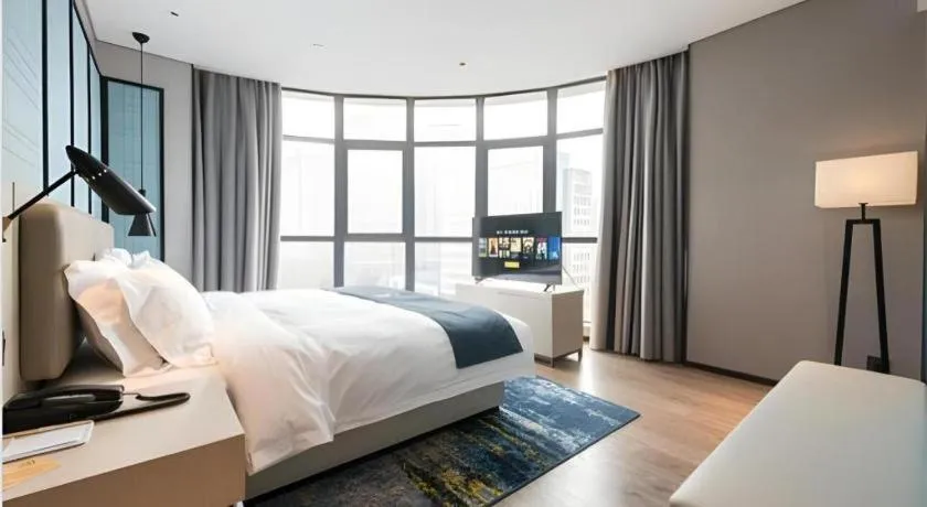 Bed in Echarm Hotel Wuxi Zhongnan Road Ancient Canal