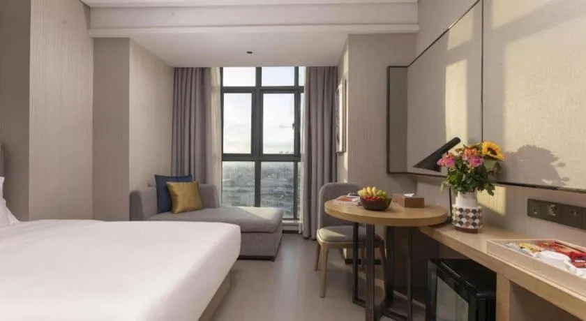 Bed in Echarm Hotel Wuxi Zhongnan Road Ancient Canal