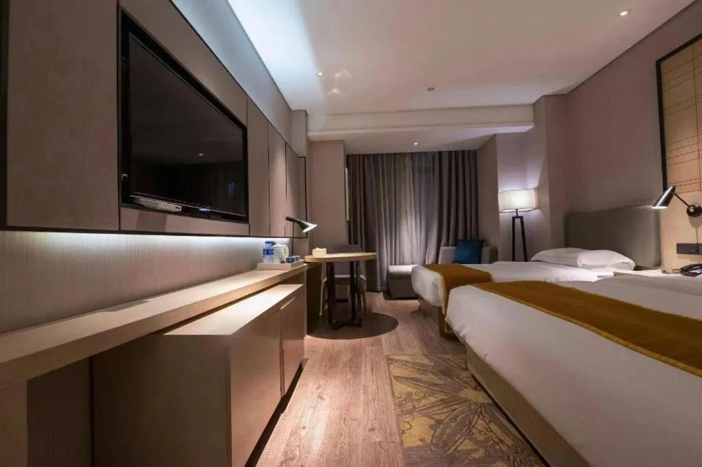 Bed in Echarm Hotel Wuxi Zhongnan Road Ancient Canal