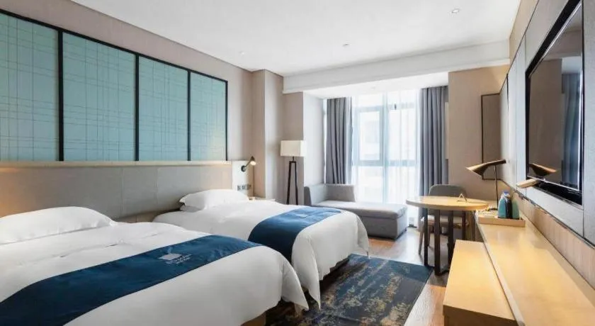 Bed in Echarm Hotel Wuxi Zhongnan Road Ancient Canal
