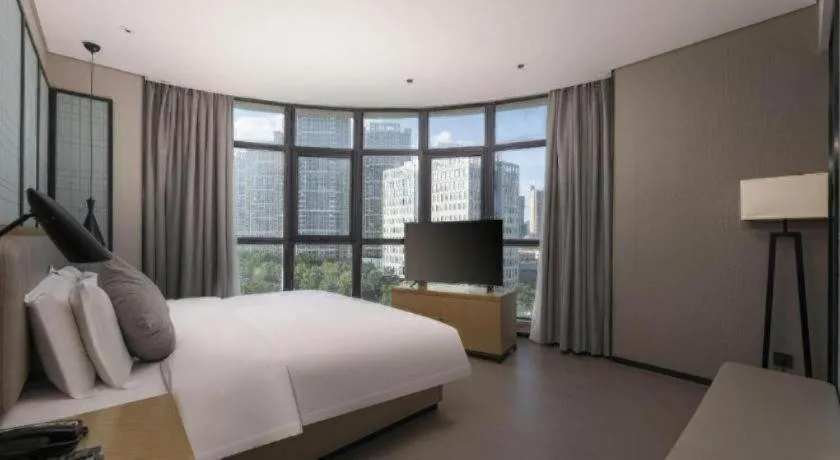 Bed in Echarm Hotel Wuxi Zhongnan Road Ancient Canal