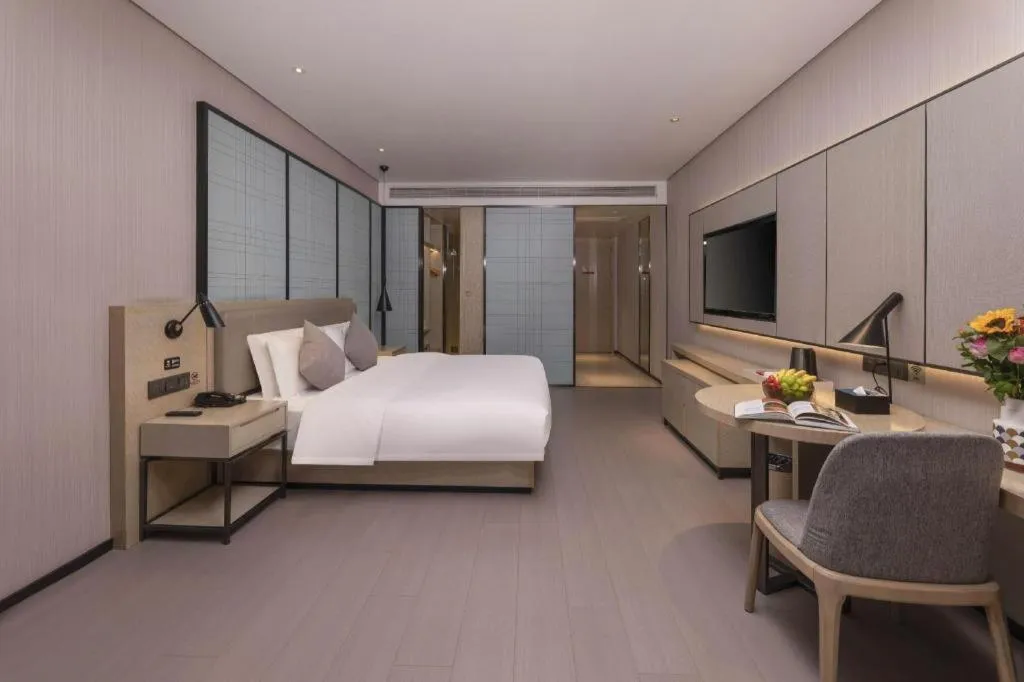 Bed in Echarm Hotel Wuxi Zhongnan Road Ancient Canal