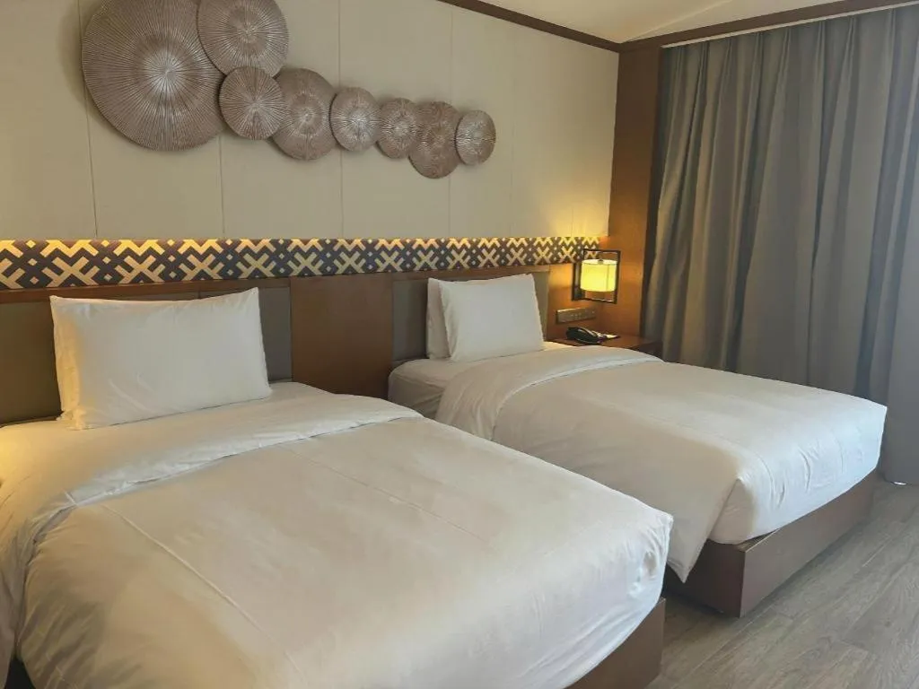 Bed in La Fountain Hotel & Resort Sanya