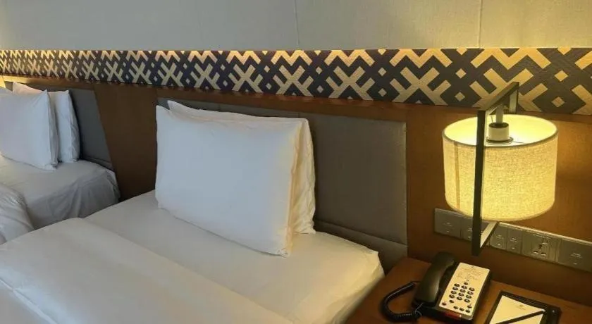 Bed in La Fountain Hotel & Resort Sanya