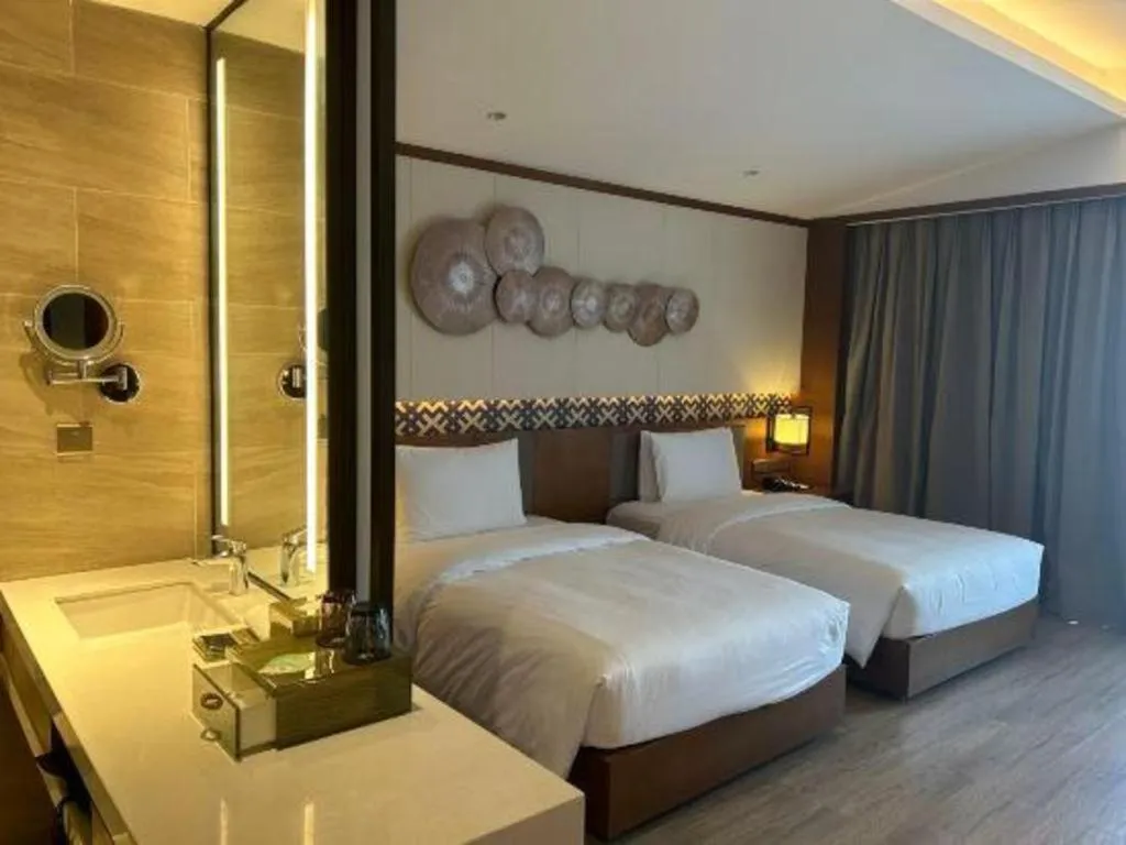Bed in La Fountain Hotel & Resort Sanya