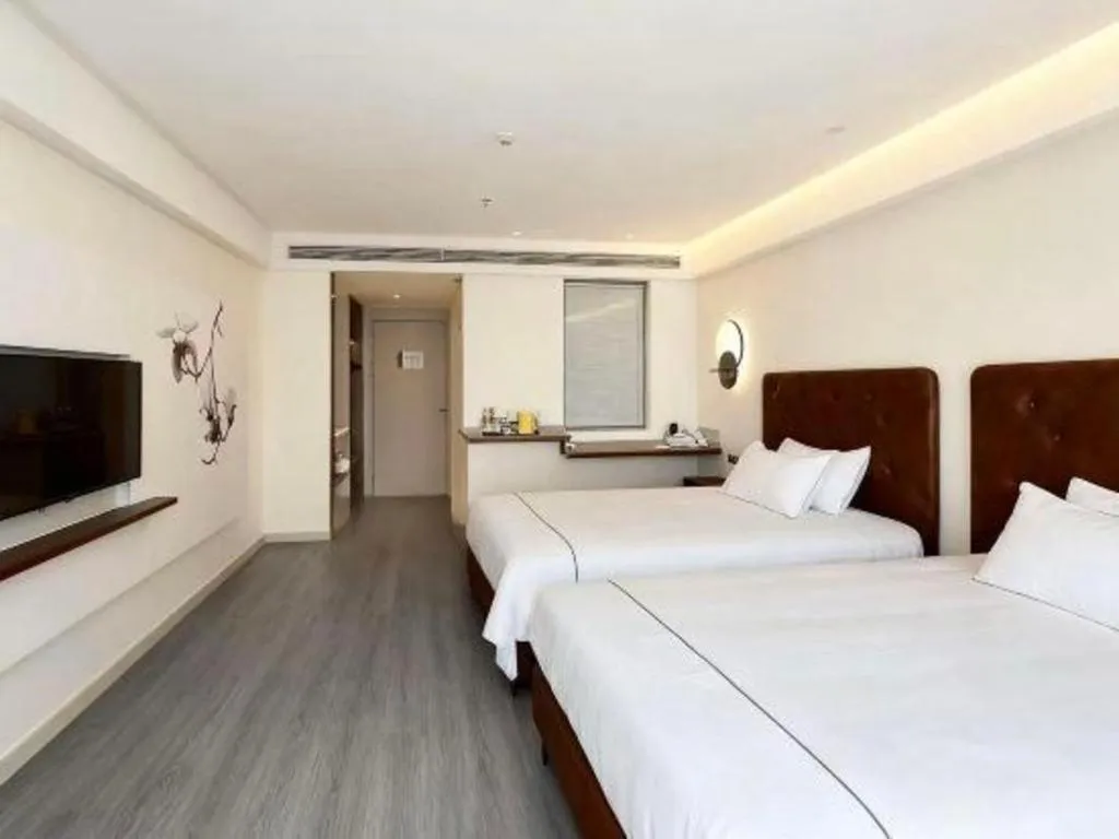 Bed in Magnotel Hotel Huizhou South Station Branch