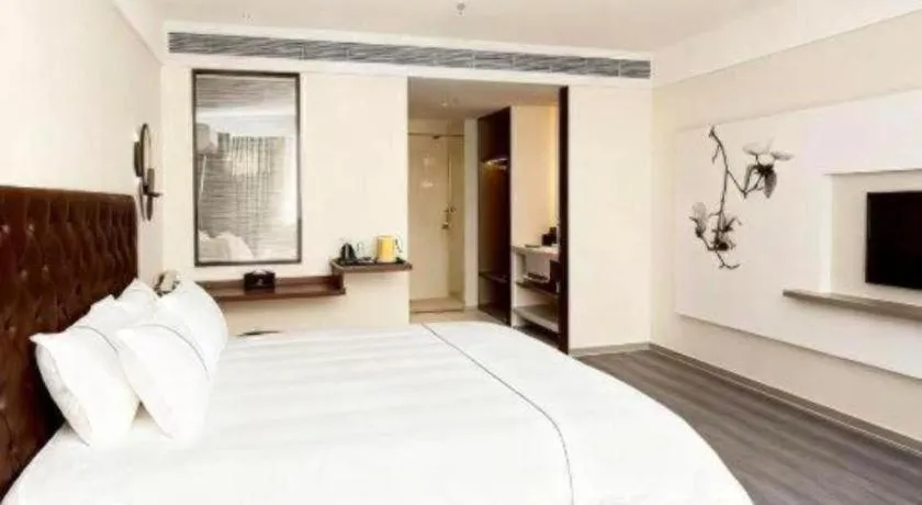 Bed in Magnotel Hotel Huizhou South Station Branch