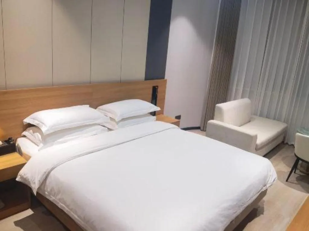 Bed in Magnotel Hotel Huizhou South Station Branch