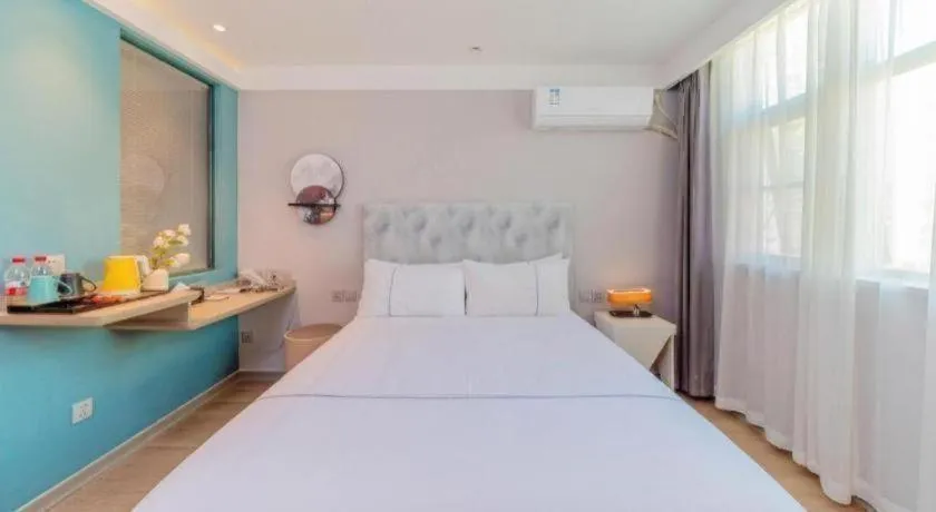 Bed in Magnotel Hotel Huizhou South Station Branch