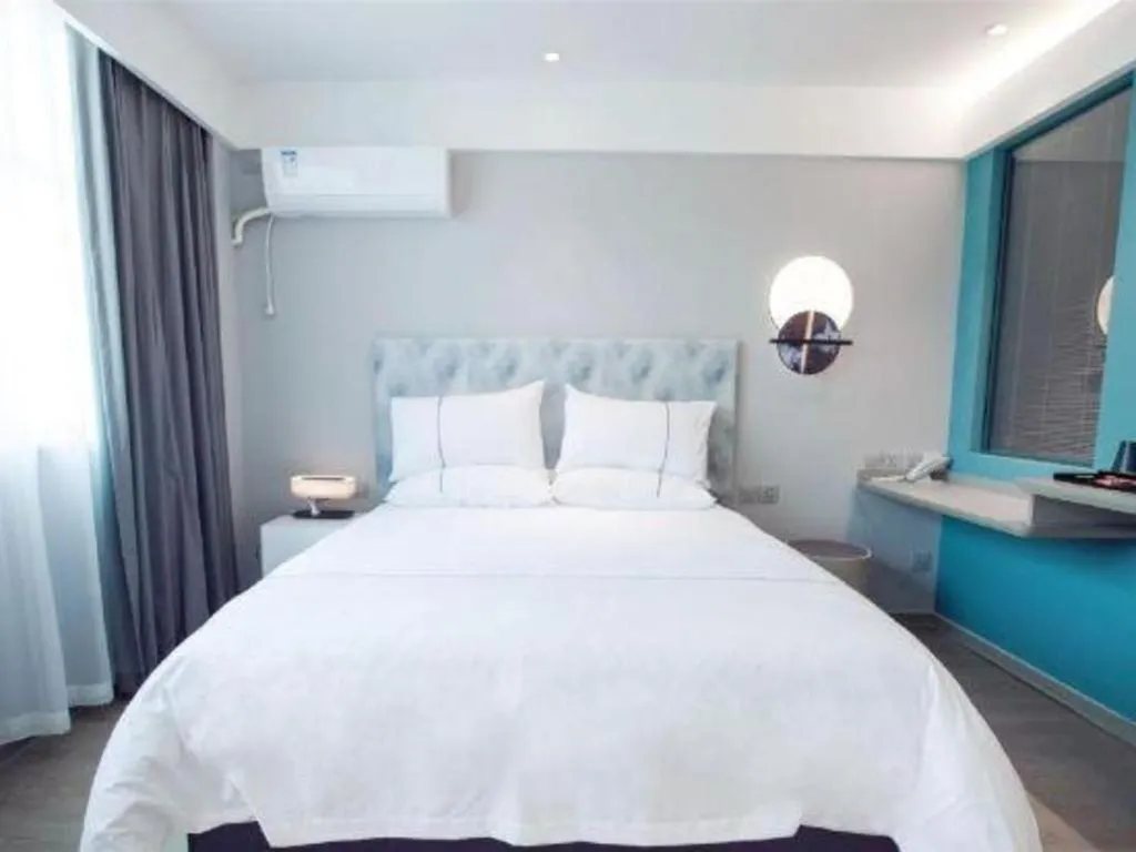 Bed in Magnotel Hotel Huizhou South Station Branch