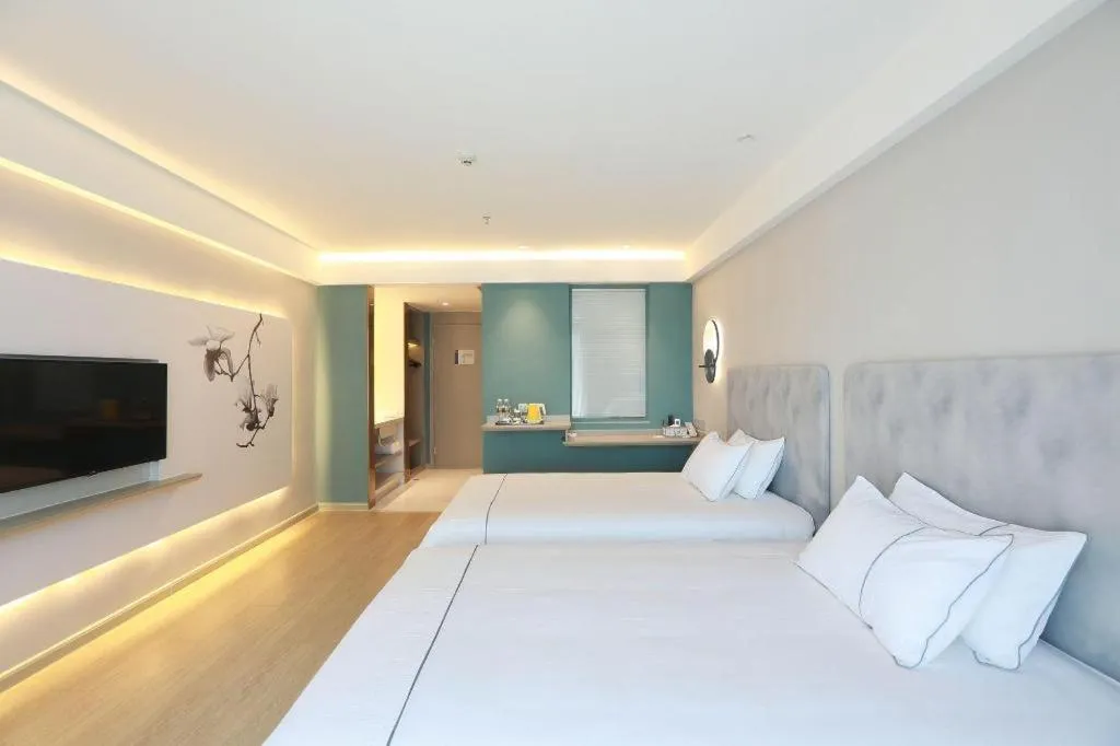 Bed in Magnotel Hotel Huizhou South Station Branch