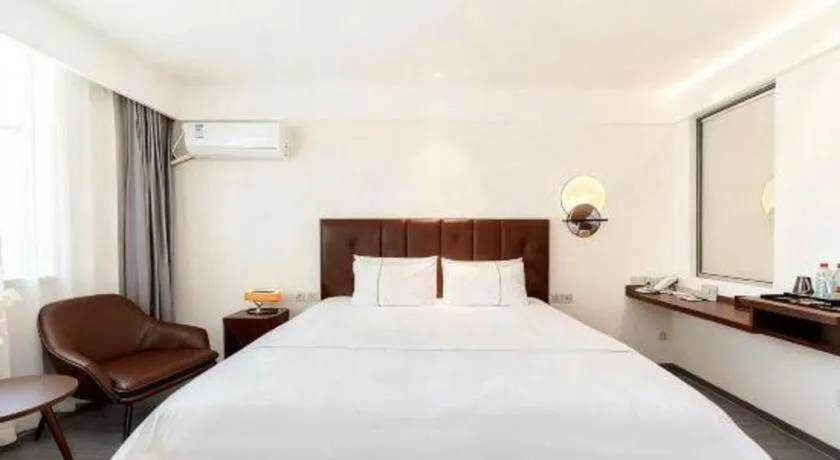 Bed in Magnotel Hotel Huizhou South Station Branch