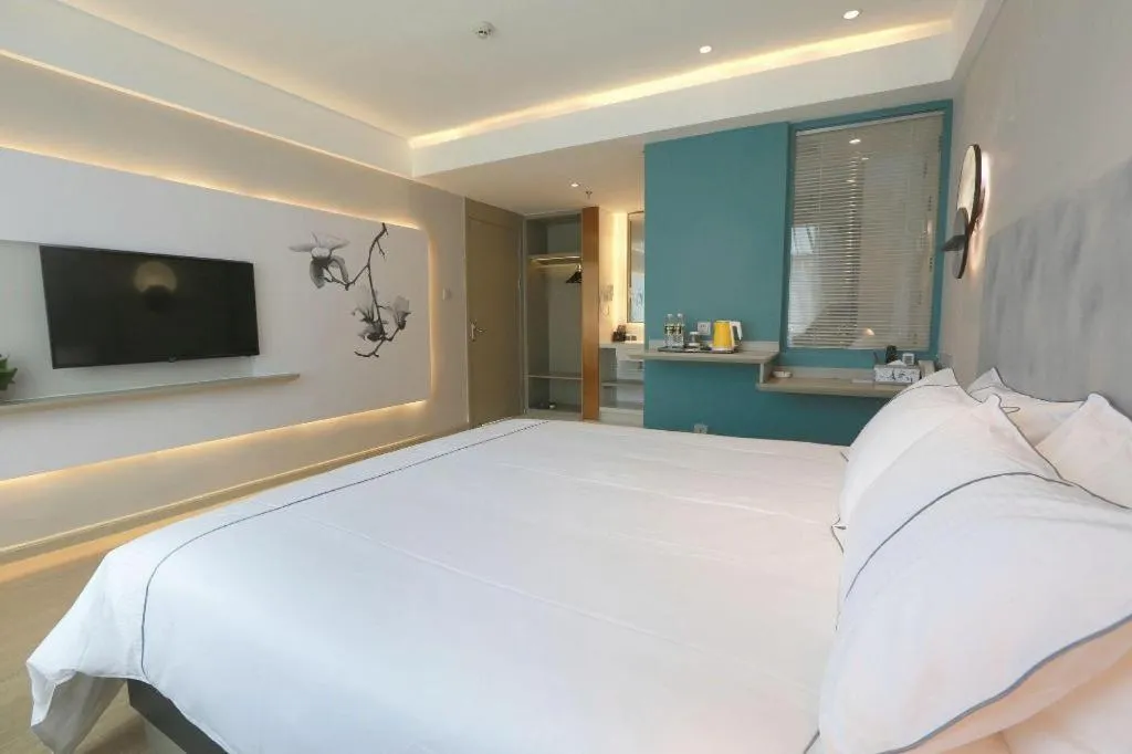 Bed in Magnotel Hotel Huizhou South Station Branch