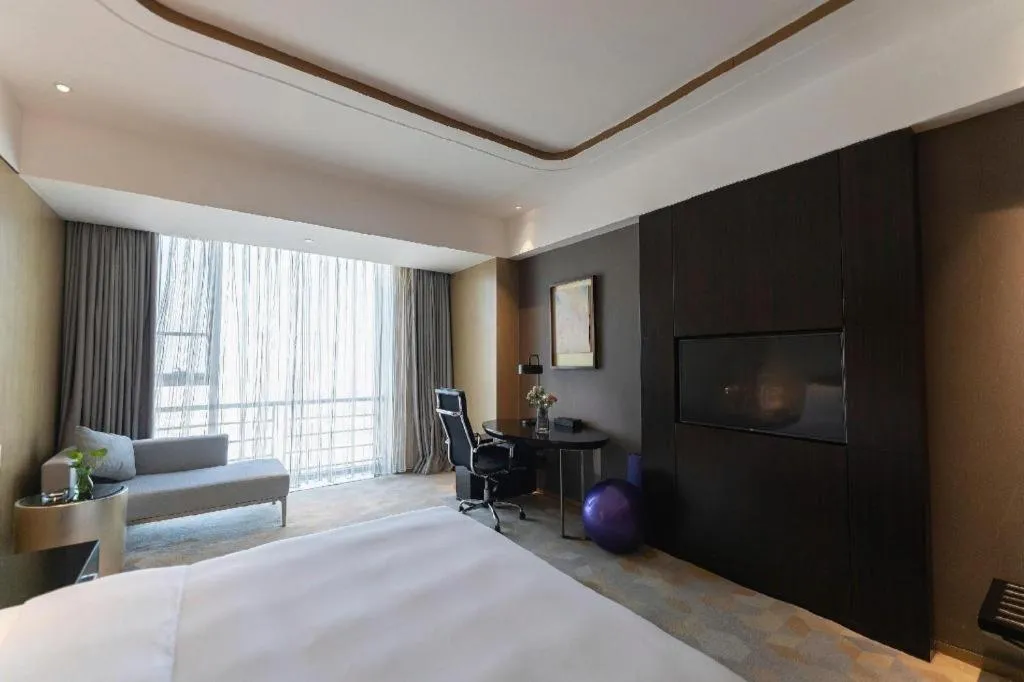 Bed in The QUBE Hotel Jingzhou