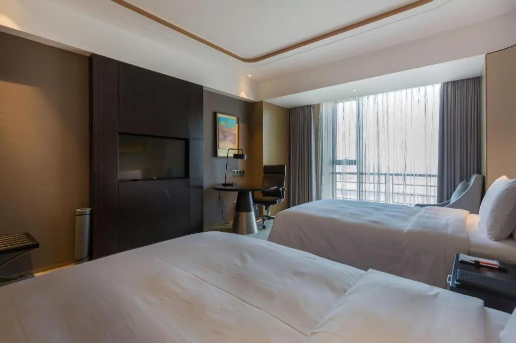 Bed in The QUBE Hotel Jingzhou