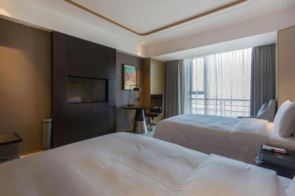 Bed in The QUBE Hotel Jingzhou