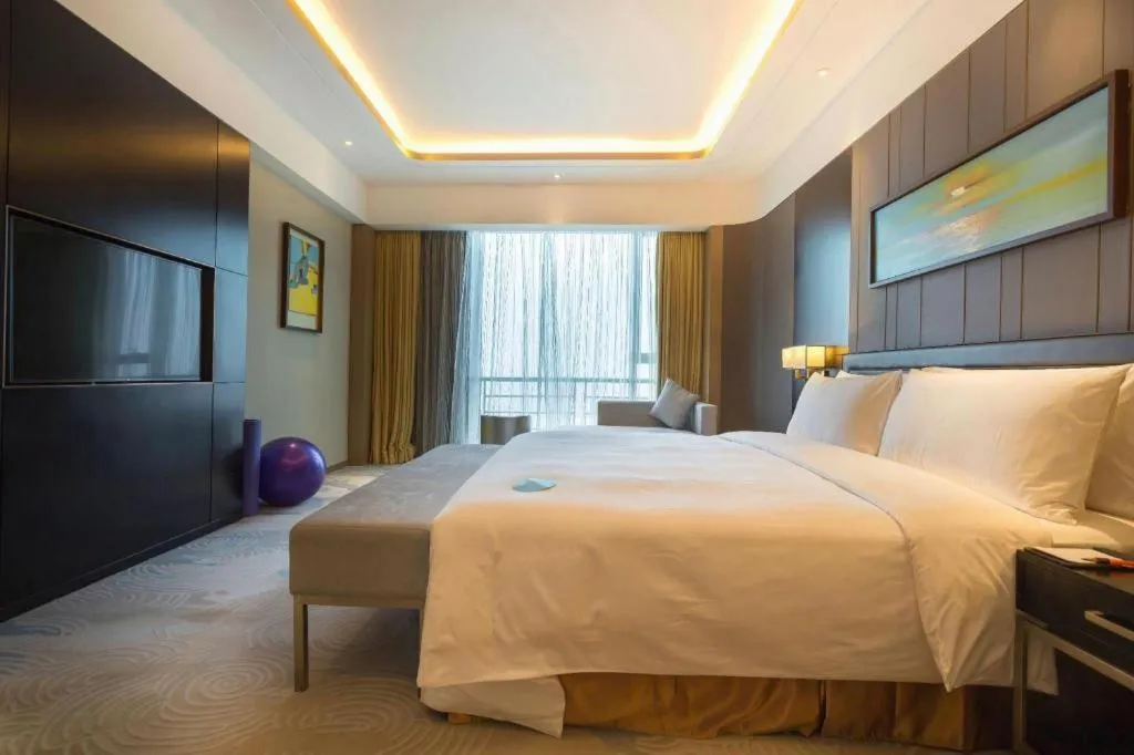 Bed in The QUBE Hotel Jingzhou