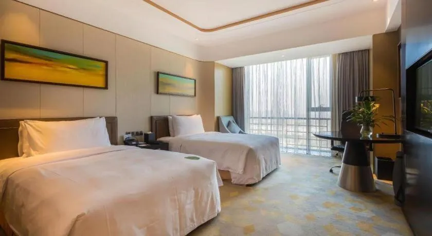 Bed in The QUBE Hotel Jingzhou