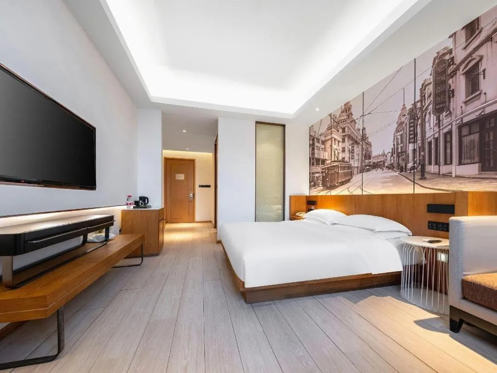 Bed in Jinjiang Metropolo Hotel Shanghai Hongqiao International Exhibition Center Branch