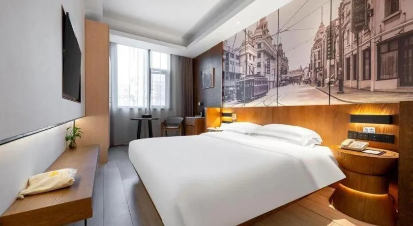 Bed in Jinjiang Metropolo Hotel Shanghai Hongqiao International Exhibition Center Branch