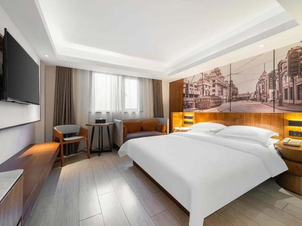 Bed in Jinjiang Metropolo Hotel Shanghai Hongqiao International Exhibition Center Branch
