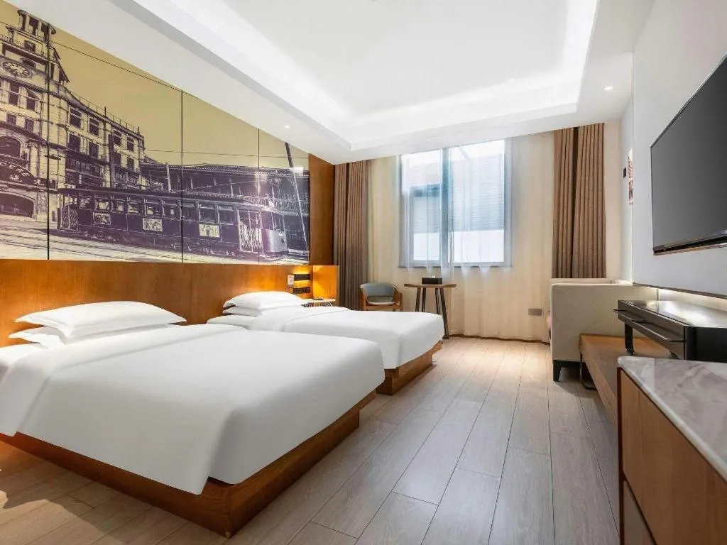 Bed in Jinjiang Metropolo Hotel Shanghai Hongqiao International Exhibition Center Branch