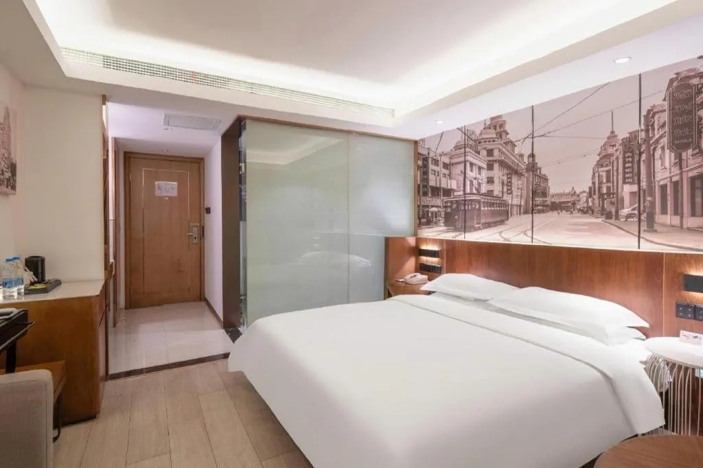 Bed in Jinjiang Metropolo Hotel Shanghai Hongqiao International Exhibition Center Branch