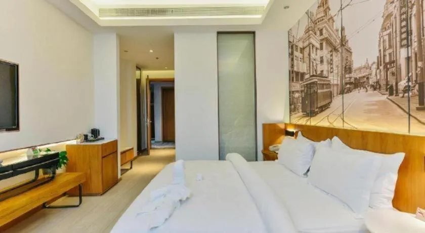 Bed in Jinjiang Metropolo Hotel Shanghai Hongqiao International Exhibition Center Branch