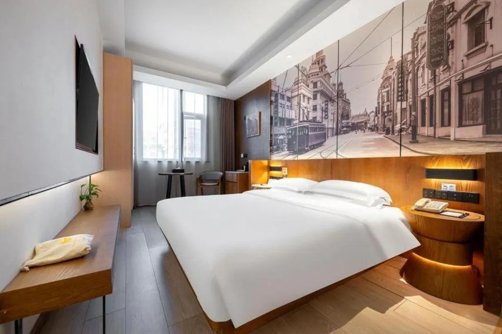 Bed in Jinjiang Metropolo Hotel Shanghai Hongqiao International Exhibition Center Branch