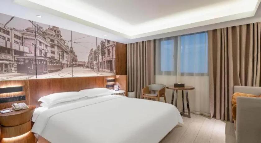 Bed in Jinjiang Metropolo Hotel Shanghai Hongqiao International Exhibition Center Branch