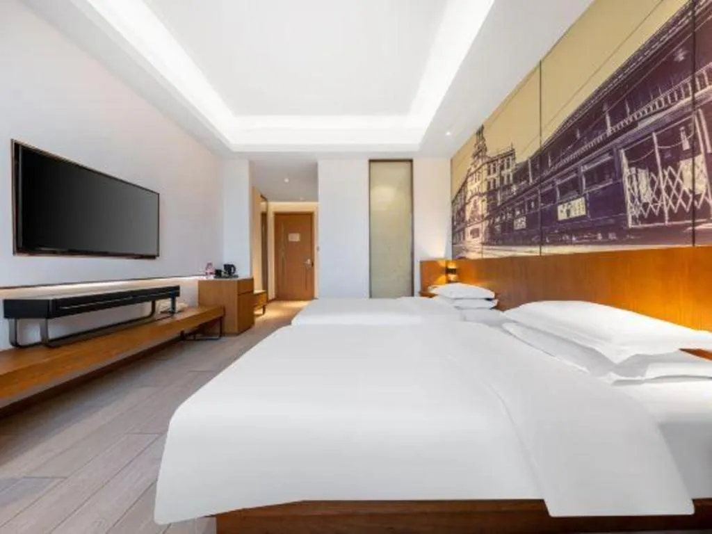 Bed in Jinjiang Metropolo Hotel Shanghai Hongqiao International Exhibition Center Branch