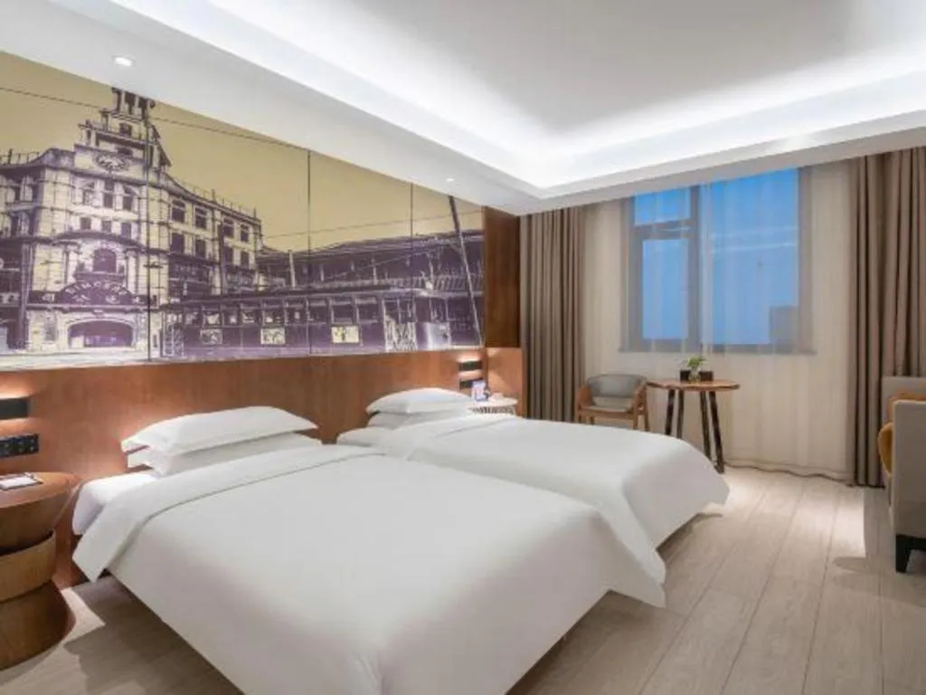 Bed in Jinjiang Metropolo Hotel Shanghai Hongqiao International Exhibition Center Branch