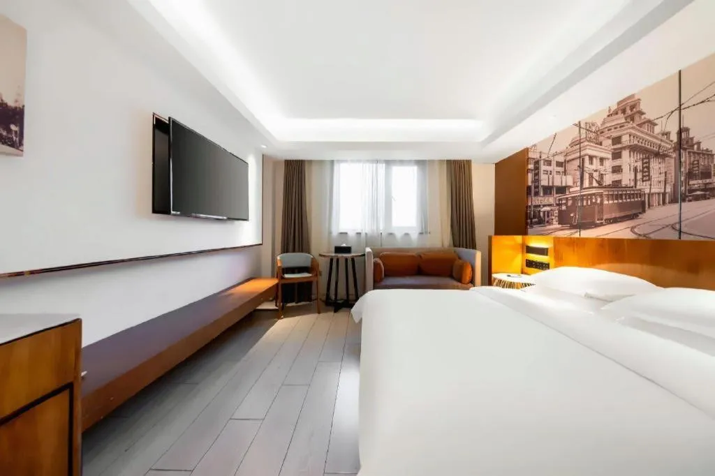Bed in Jinjiang Metropolo Hotel Shanghai Hongqiao International Exhibition Center Branch