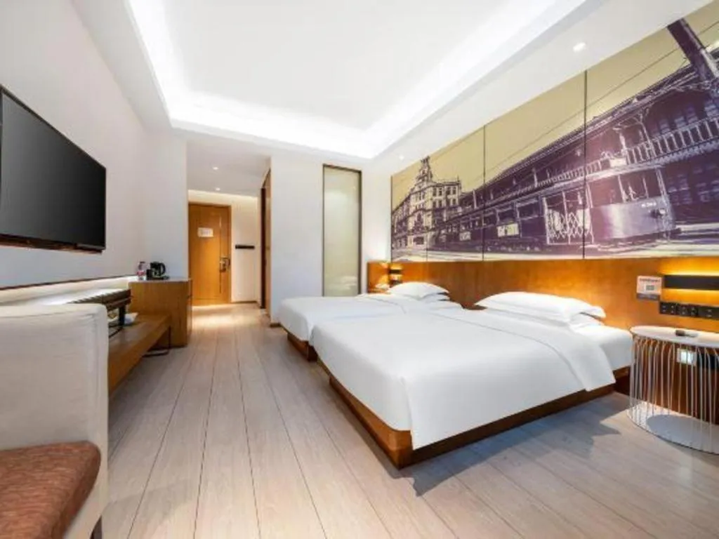 Bed in Jinjiang Metropolo Hotel Shanghai Hongqiao International Exhibition Center Branch