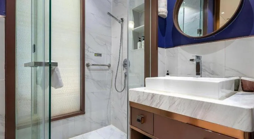 Bed in Jinjiang Metropolo Hotel Shanghai Hongqiao International Exhibition Center Branch