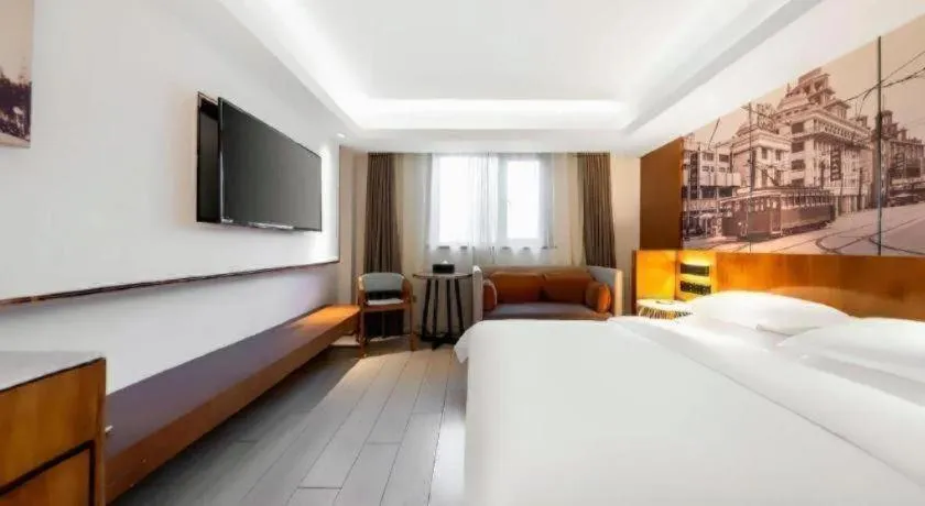 Bed in Jinjiang Metropolo Hotel Shanghai Hongqiao International Exhibition Center Branch