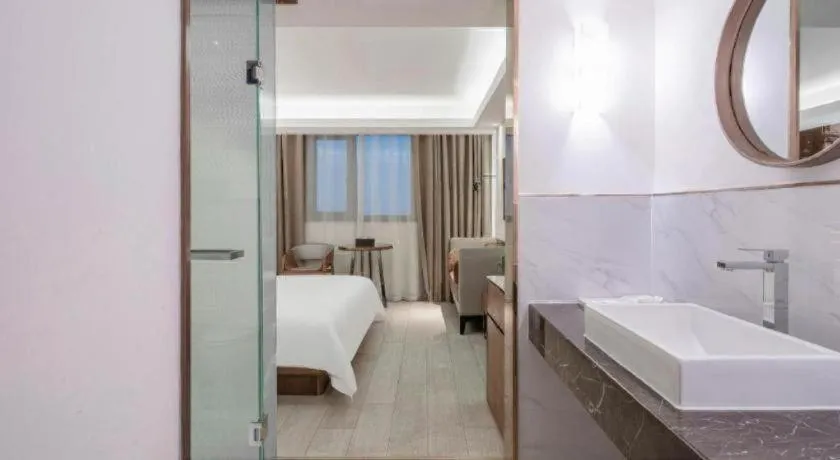 Bed in Jinjiang Metropolo Hotel Shanghai Hongqiao International Exhibition Center Branch