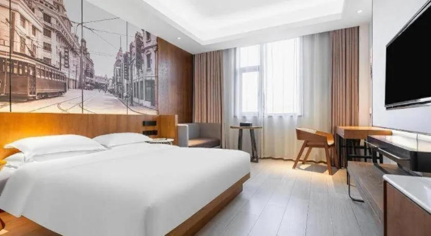 Bed in Jinjiang Metropolo Hotel Shanghai Hongqiao International Exhibition Center Branch
