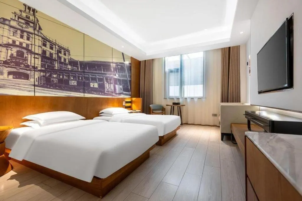Bed in Jinjiang Metropolo Hotel Shanghai Hongqiao International Exhibition Center Branch